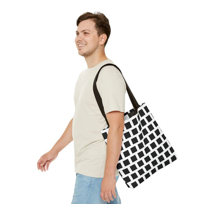 Black and white canvas tote bag with black square pattern and black shoulder strap for versatile use