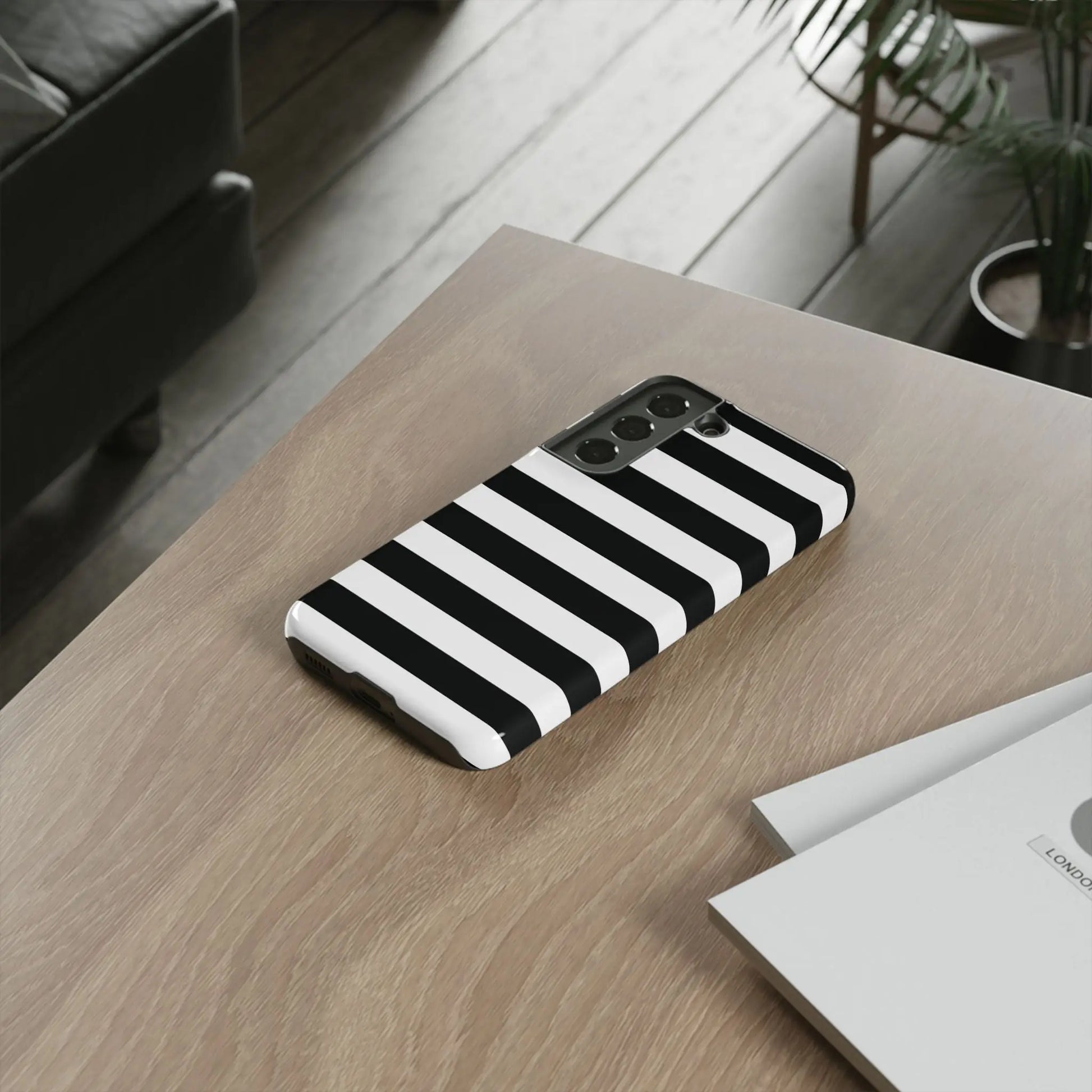 Black white stripe phone case with bold horizontal stripes shown from the back for iphone samsung and google pixel phones