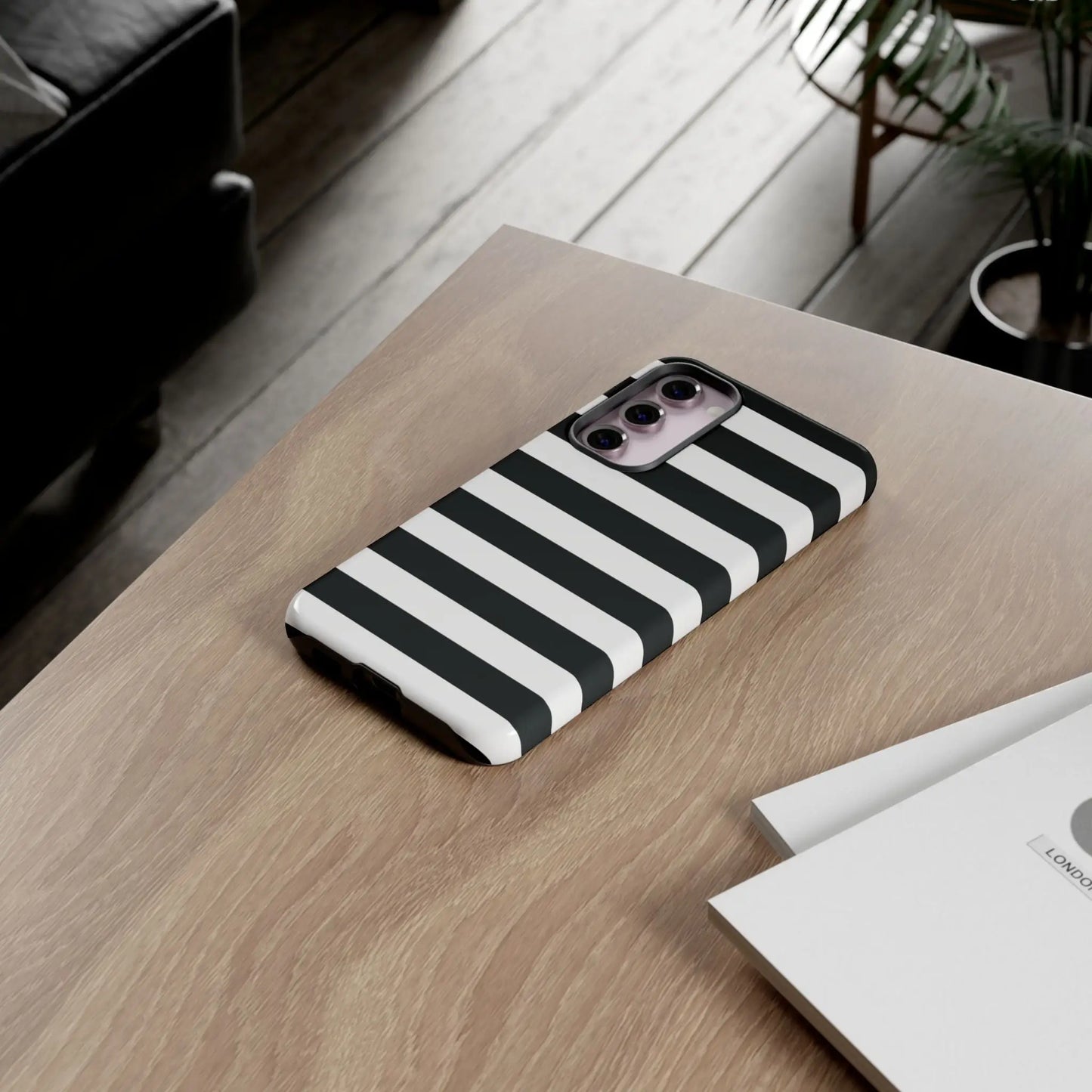 Black white stripe phone case showing the back with sleek modern design for iPhone Samsung s and Google Pixel phones