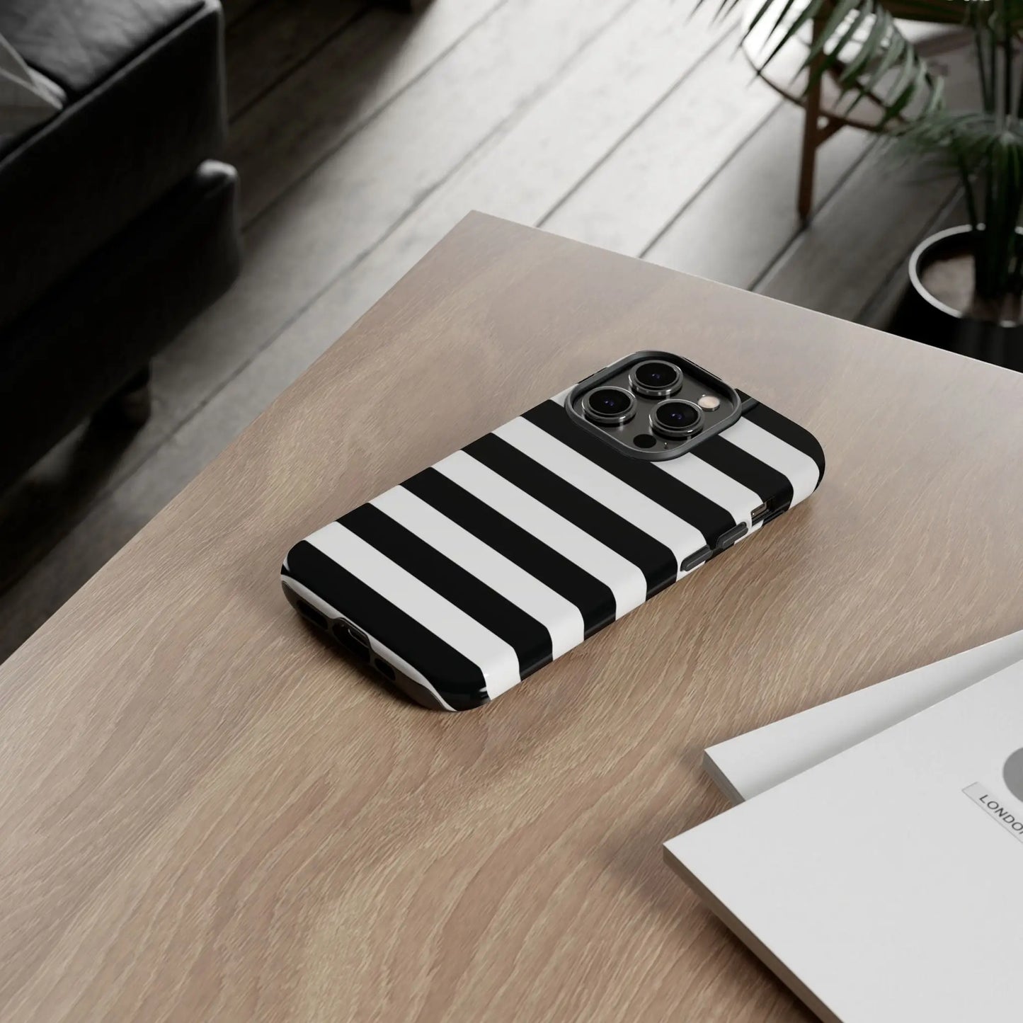 Black white stripe phone case with bold horizontal stripes on back side designed for iphone triple lens camera