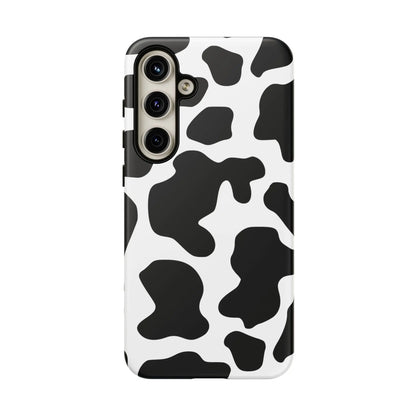 Black cow print phone case showing the back side with protective black and white cow pattern design