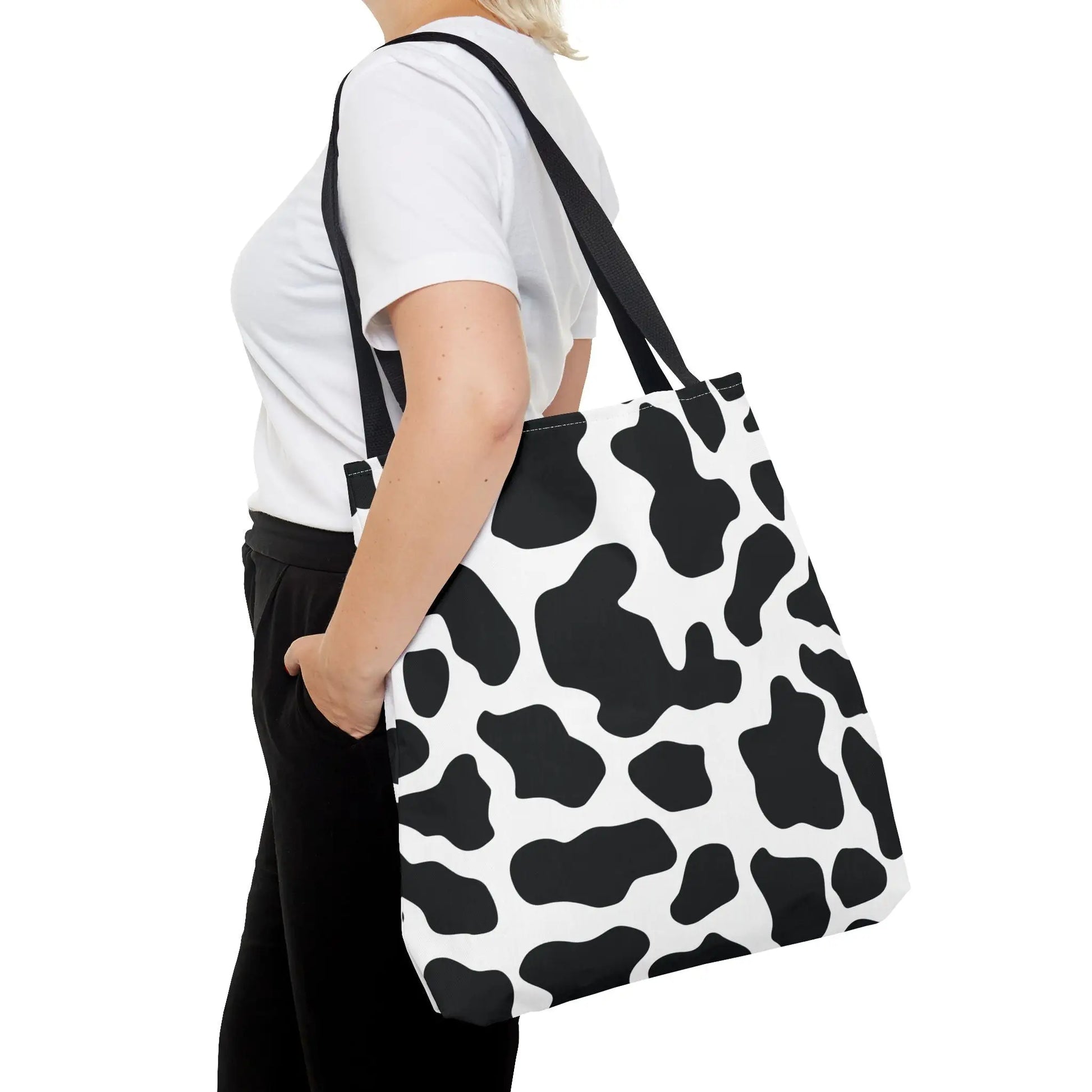 Black and white cow print canvas tote bag with black straps large reusable shopping and travel print tote bag