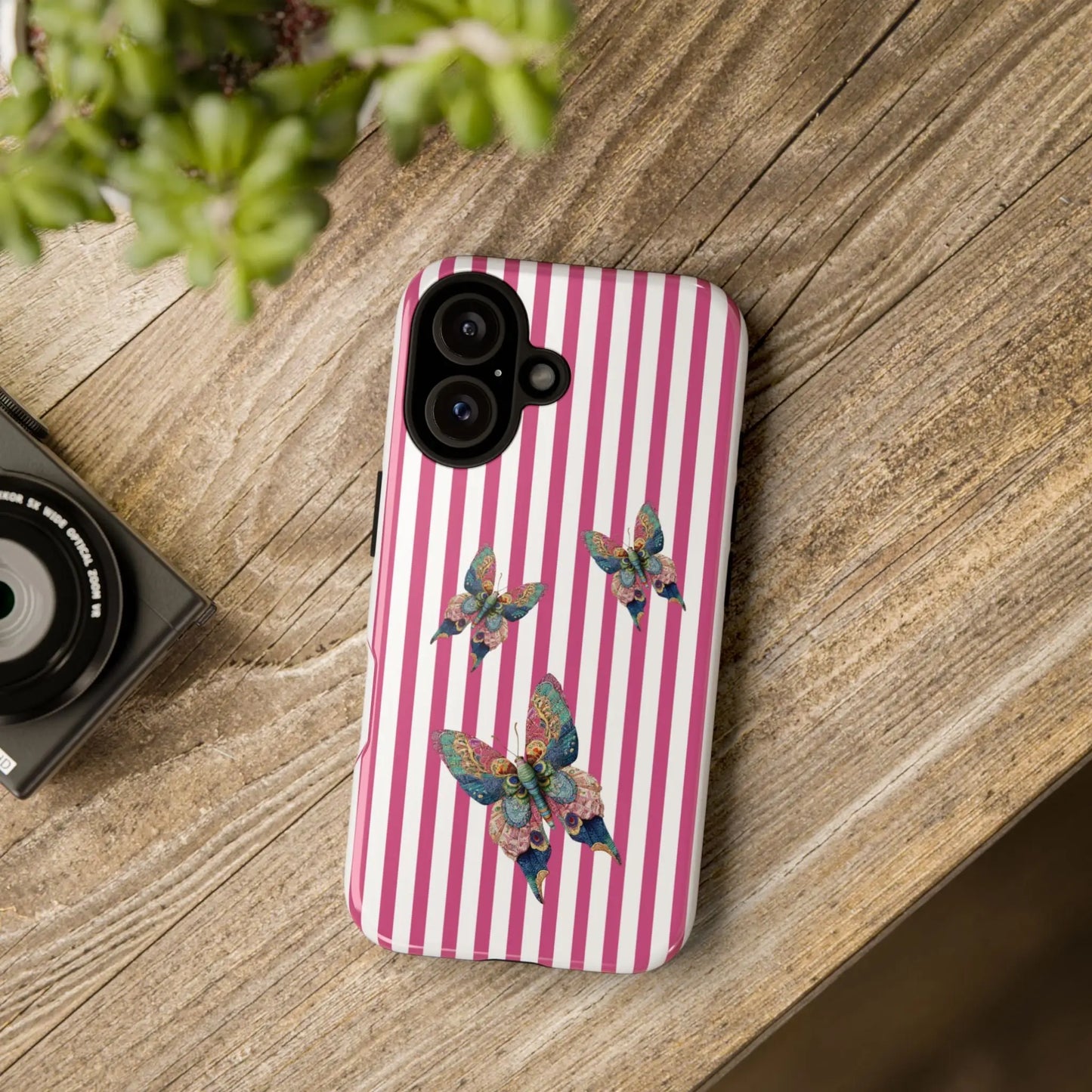 Floral butterfly pink stripe phone case with colorful butterfly illustrations on pink and white striped back side