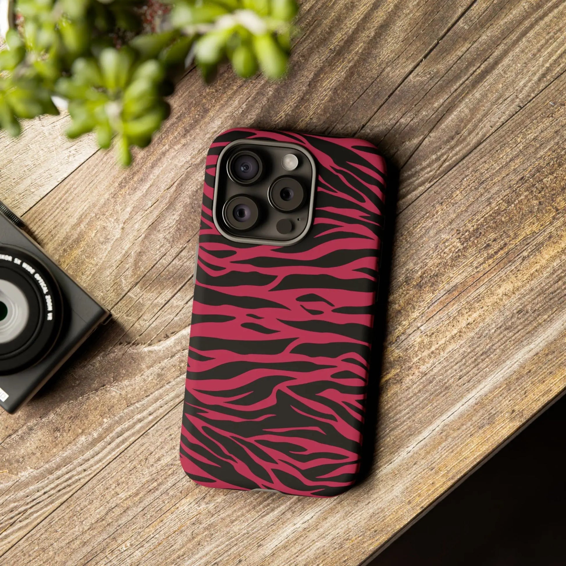 Magenta wild tiger phone case with vibrant pink and black wild tiger pattern print and sleek protective design back view