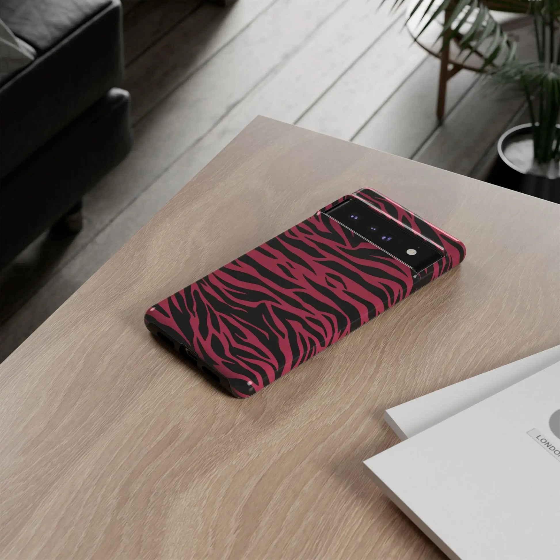 Magenta wild tiger phone case with vibrant pink and black wild tiger pattern print and a sleek glossy finish back view