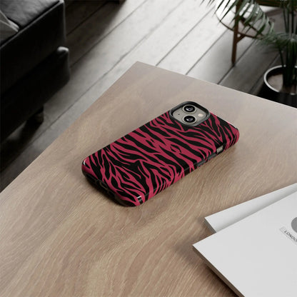 Back side of a sleek protective phone case with vibrant magenta wild tiger pattern print in pink and black zebra stripes