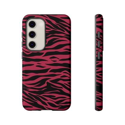 Back side of a protective magenta wild tiger pattern phone case with vibrant pink and black zebra striped design