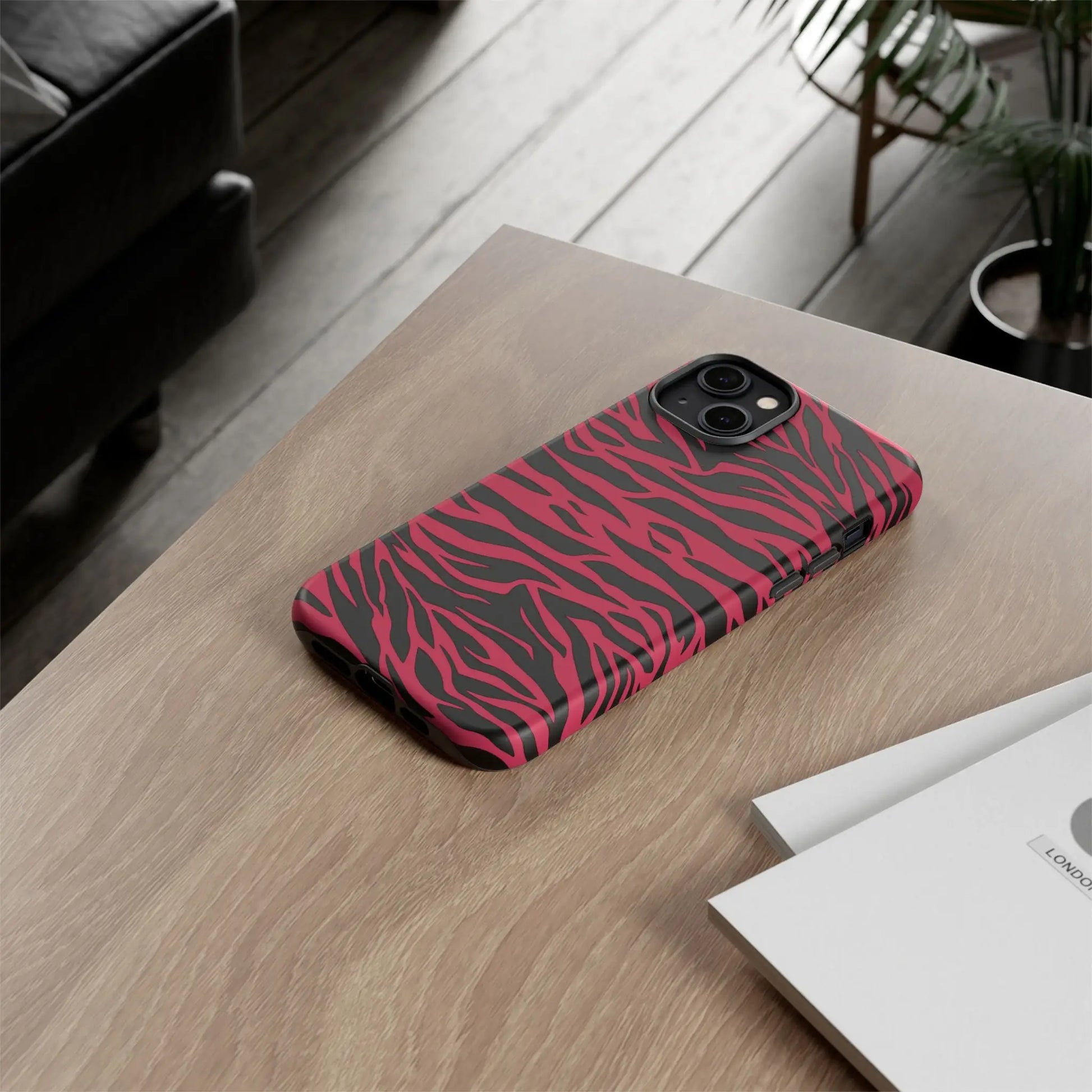 Magenta wild tiger phone case featuring a vibrant pink and black tiger pattern print with a sleek protective design back view