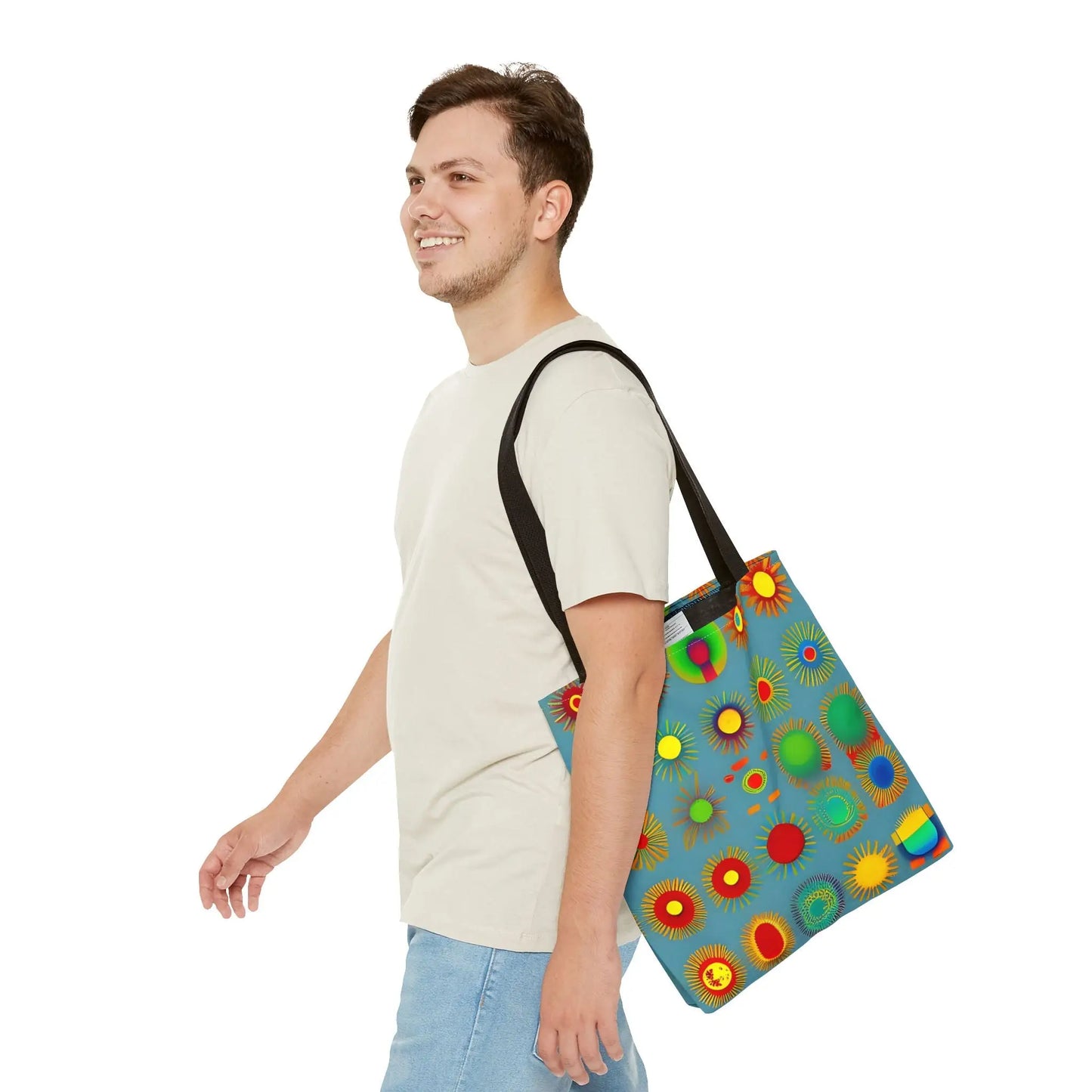Blue canvas sun pattern tote bag with black straps featuring colorful stylized suns in red yellow green and orange