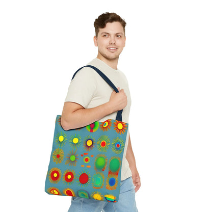 Blue canvas sun pattern tote bag with vibrant sunburst pattern in reds yellows greens and blues perfect for everyday use