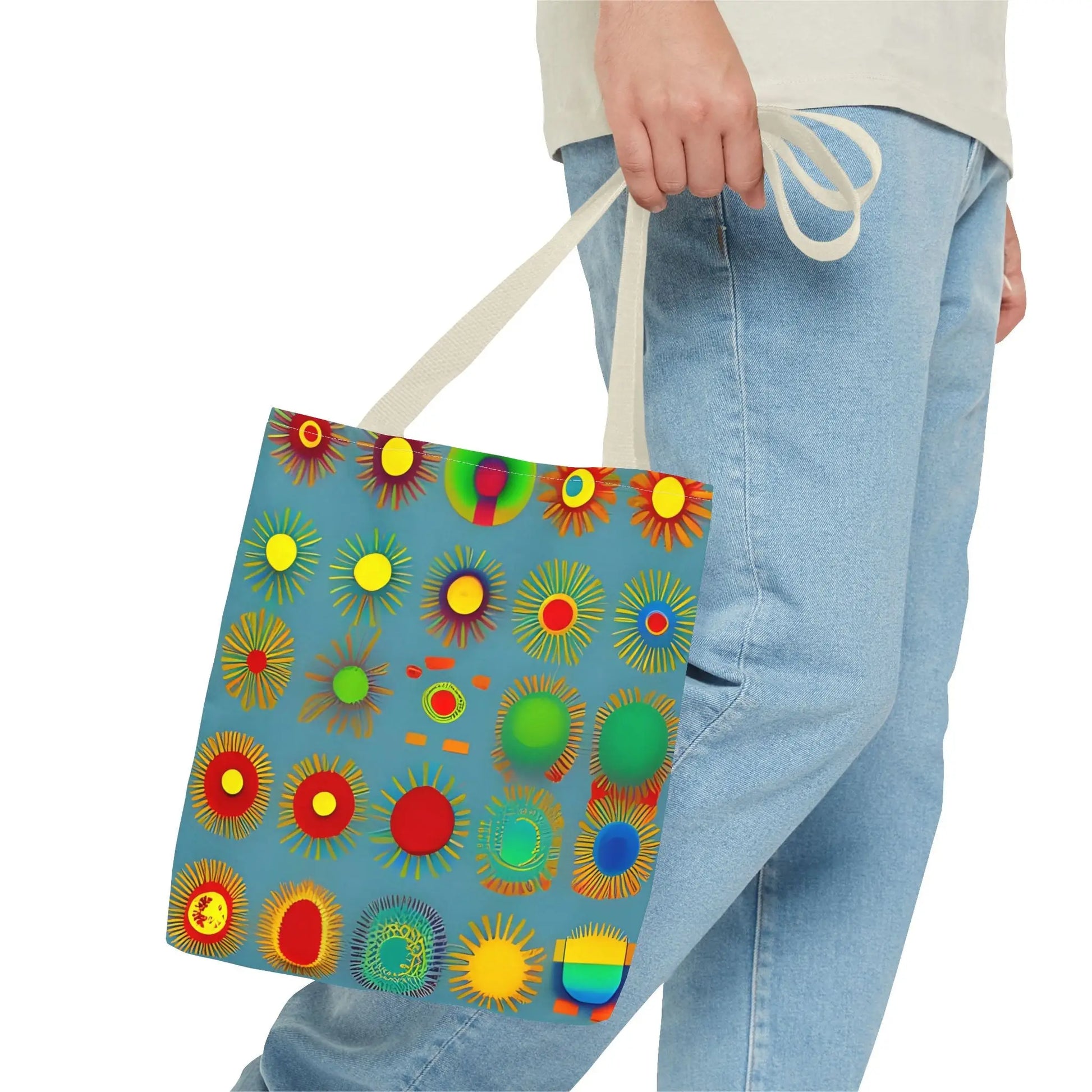 A vibrant blue canvas sun pattern tote bag with colorful sunburst circles in red yellow green and orange