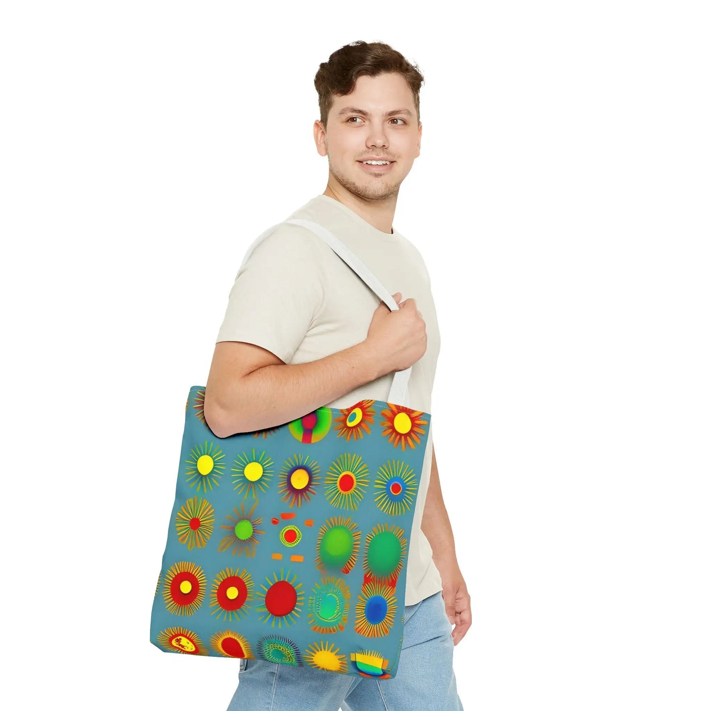 A vibrant blue sun pattern tote bag with colorful sunburst circles in red yellow green and orange pattern tote bag
