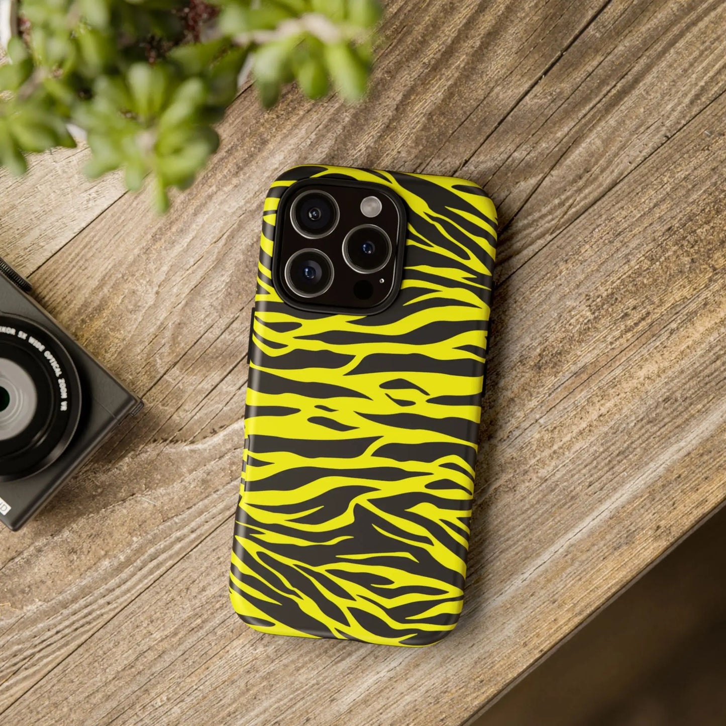 Vibrant yellow wild tiger print phone case cover with sleek black tiger print pattern shown from the back side